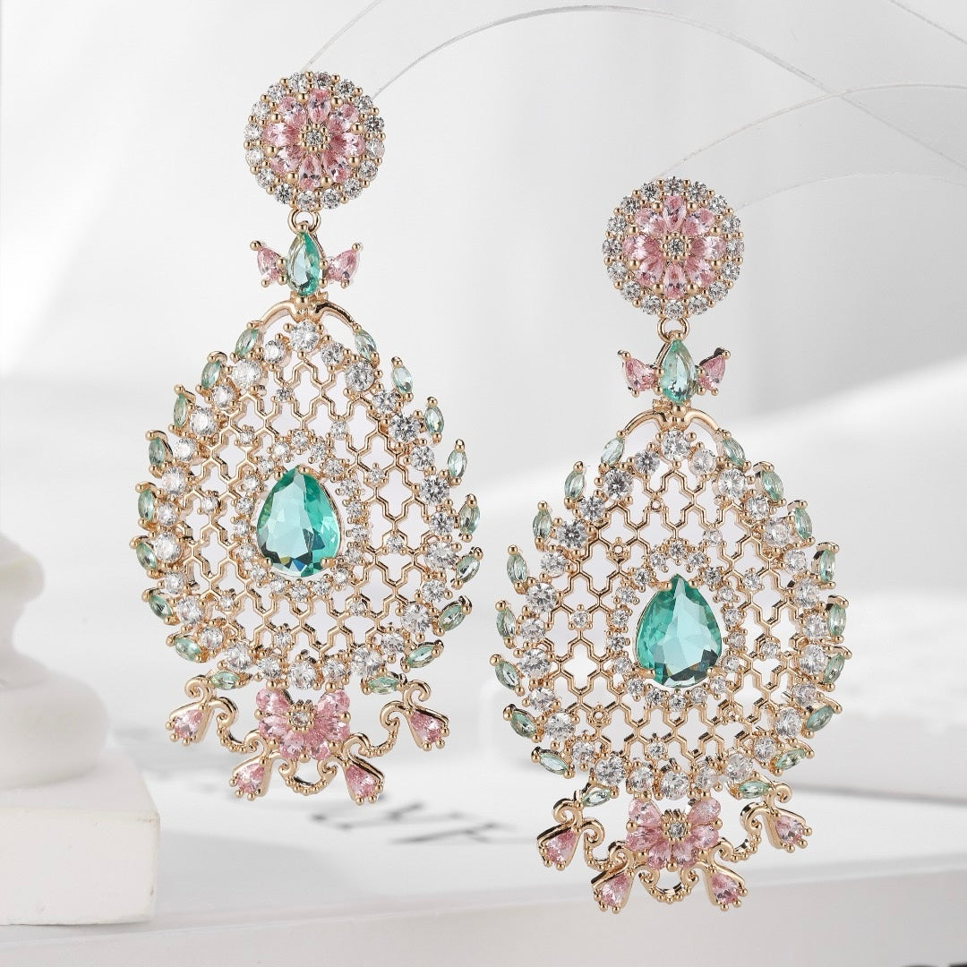 أقراط على شكل قطرة ماء على شكل قرص العسل مصنوعة بحرفية متقنة، تتميز بتصميم رائع وخفيف وفخم ومذهل وعصري. 